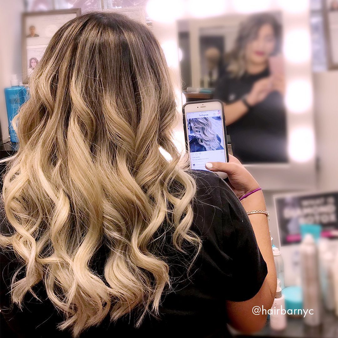 A woman taking a selfie.