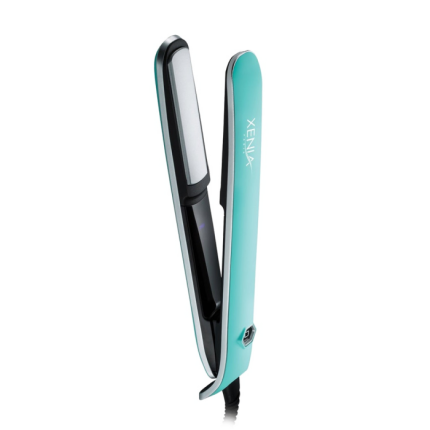 A turquoise and black Sleek Flat Iron 1" hair straightener with ceramic plates, a visible power button by the handle, and the XENLUX logo printed on the side stands partially open on a light gray background.