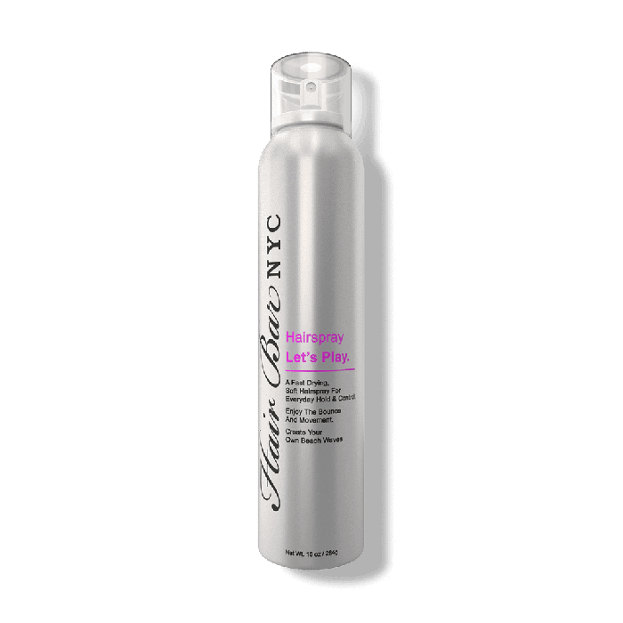 A tall silver can of “Hair Bar NYC” Let’s Play Finishing Spray for Hair stands upright on a white background. The black logo runs vertically, and black and purple text reads: “Hairspray Let’s Play.” A clear plastic cap tops the can.